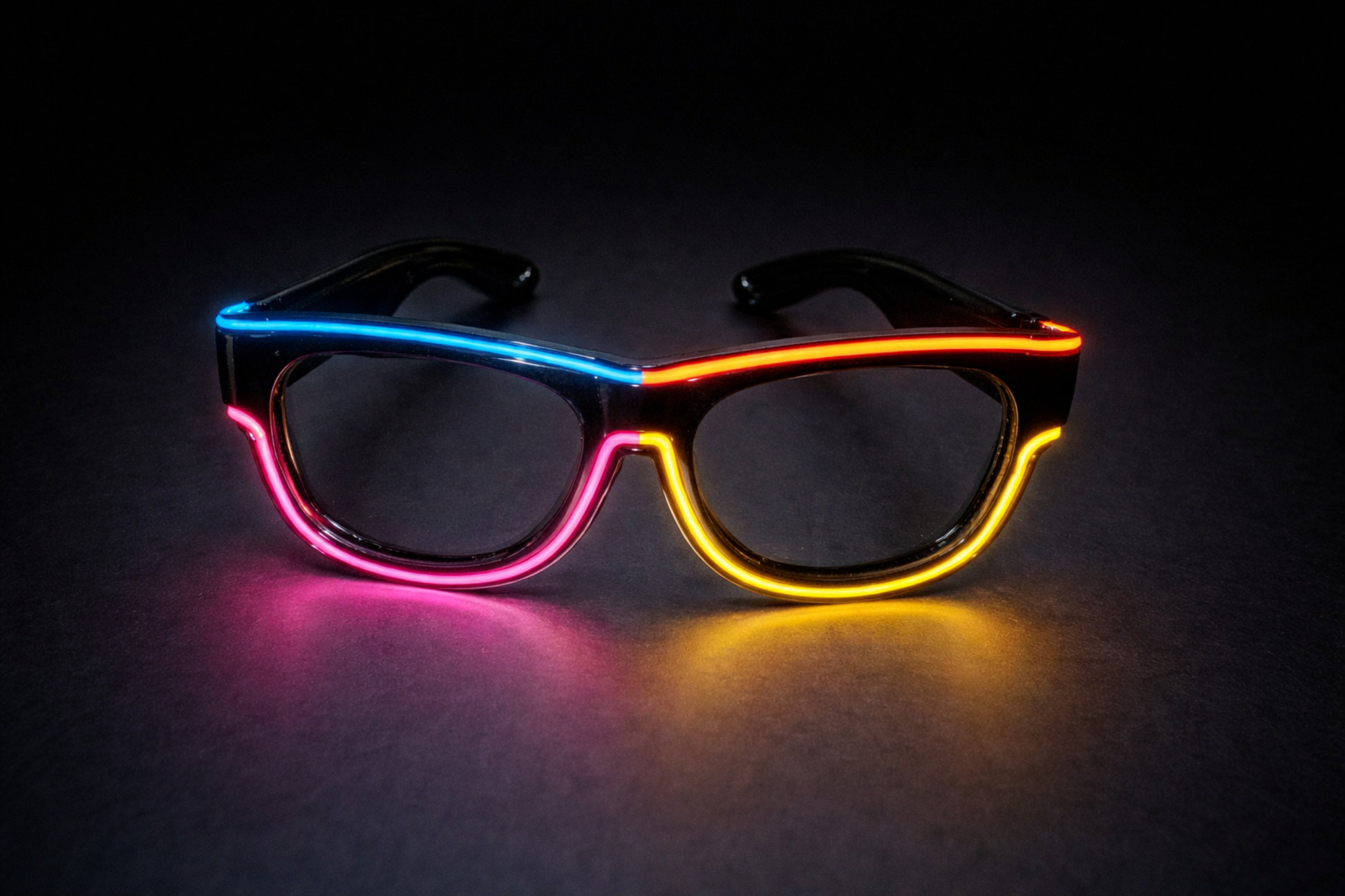 Neon glasses with pink, blue, and yellow lights on a dark background