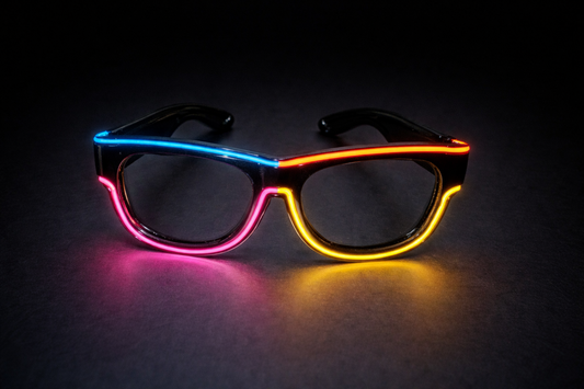 Neon glasses with pink, blue, and yellow lights on a dark background
