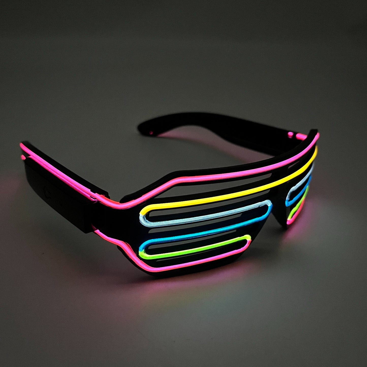Neon sunglasses with colorful frame on a dark background