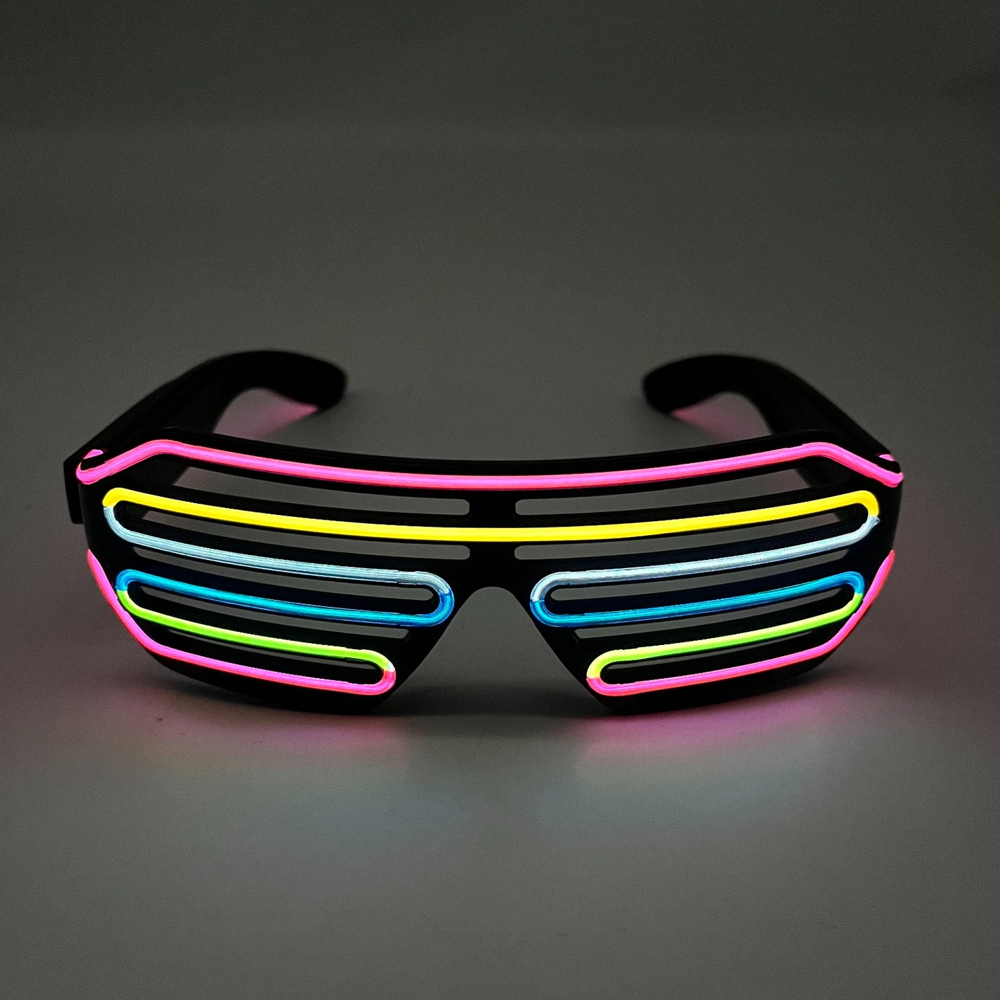 Pink Multi Color Rechargeable LED Neon Shutter Glasses on a dark background