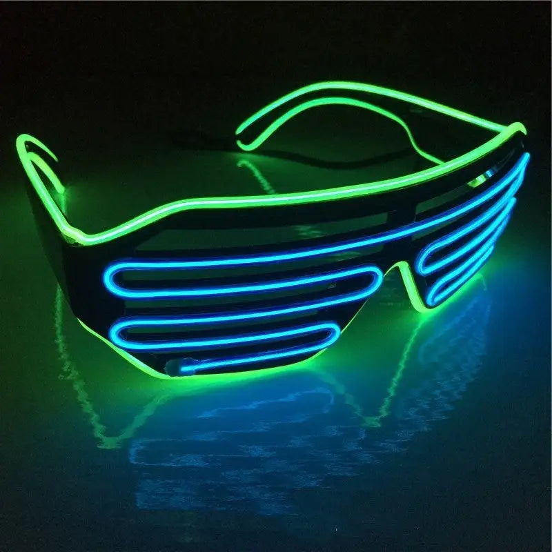 Neon green and blue LED sunglasses on a reflective surface with a dark background